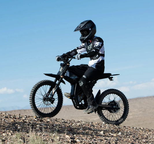 A rider testing the GT73 Pro Electric Bike Performance on a steep, rocky gravel trail to showcase off-road stability