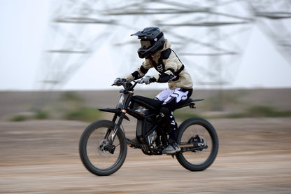Person riding a motorcycle GT73 Pro on a blurred background
