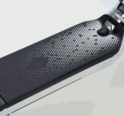 Battery pack with black and white dotted pattern mounted on a white electric scooter frame