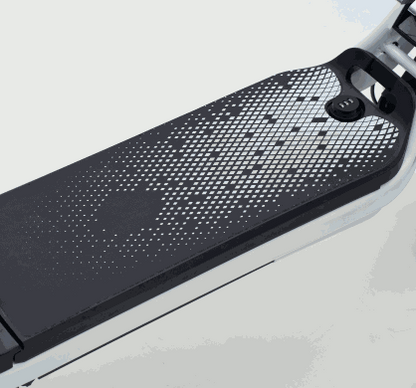 Battery pack with black and white dotted pattern mounted on a white electric scooter frame