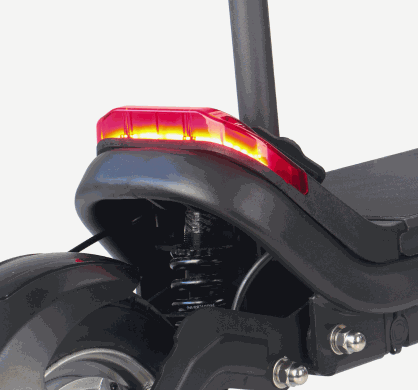 Brake Light on black electric scooter with red translucent cover and integrated suspension system