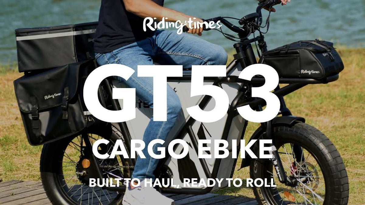GT53 - Parts on black cargo ebike with multiple black storage bags and fat tires, designed for hauling heavy loads