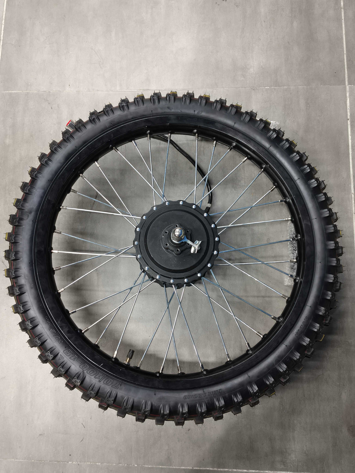 Rear Motor Wheel with black knobby tire and silver spokes on a durable metal rim for e-bike compatibility