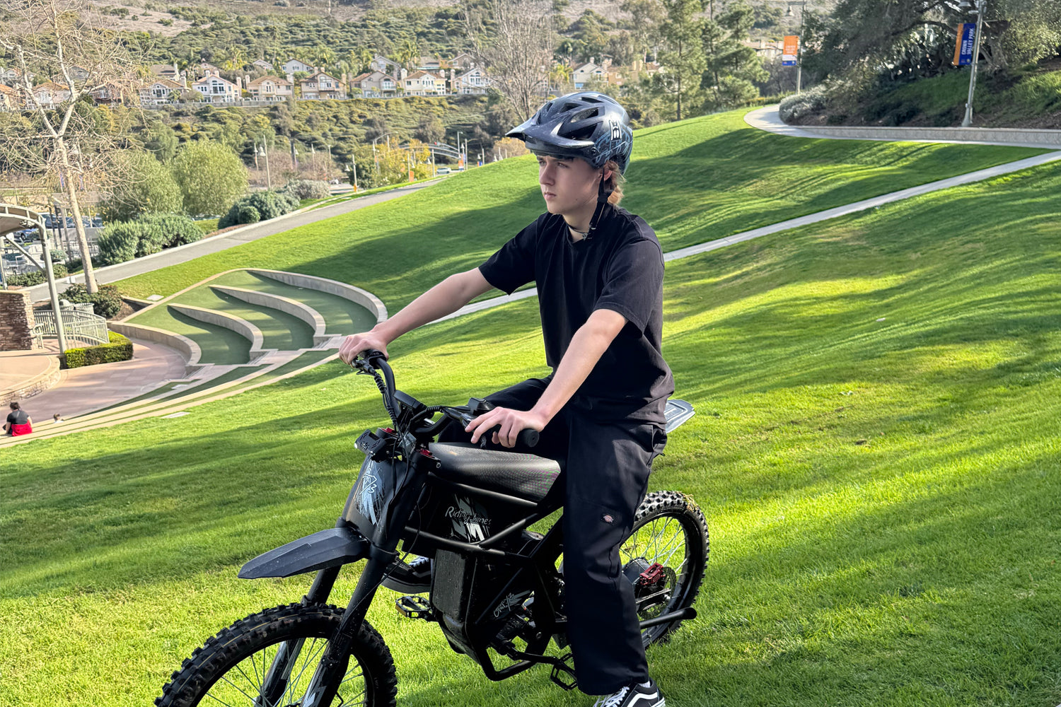GT73 Electric Motorbike with rider outdoors, featuring off-road tires.